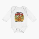 Cotton baby onesie printed with cartoon kangaroo sitting on red-check picnic rug eating Aussie meat pie under eucalyptus tree