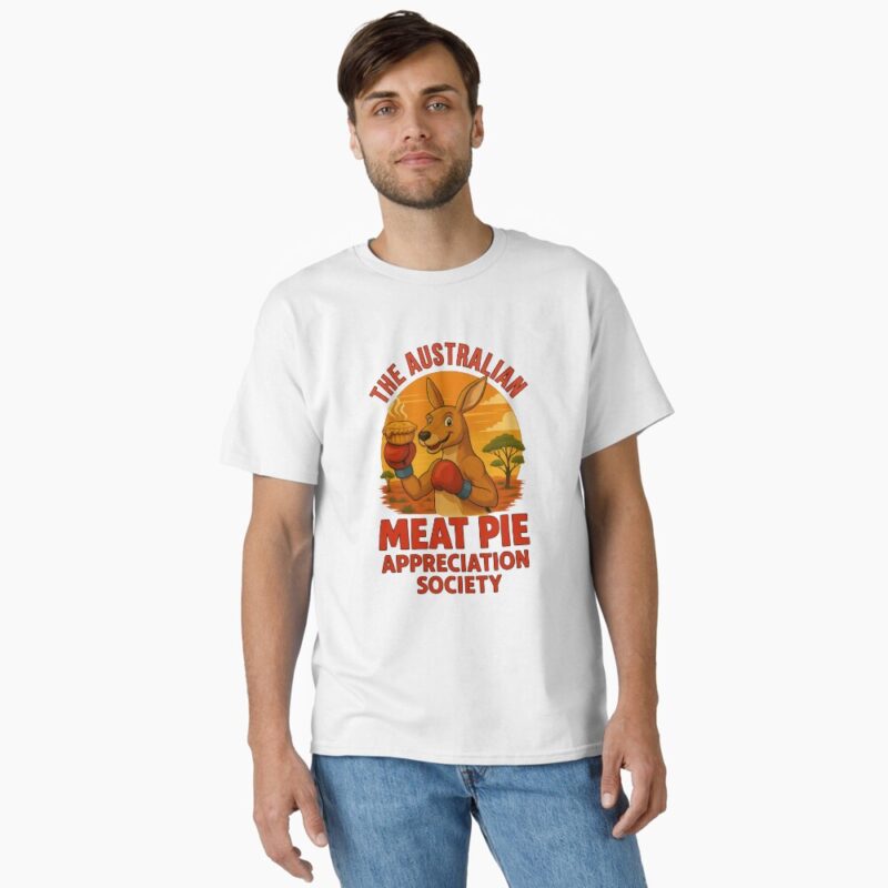 Classic T-shirt showing cartoon boxing kangaroo holding meat pie under orange outback sunset sky