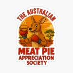 Glossy sticker of boxing kangaroo with gloves holding meat pie in front of fiery sunset