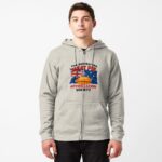 Unisex zipped hoodie printed on the back with golden Aussie meat pie over waving blue Australian flag with Southern Cross stars