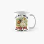 Cotton dad-cap featuring cartoon cockatoo holding tomato-sauced meat pie under gum-tree scene