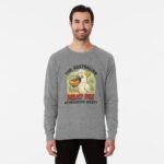 Lightweight sweatshirt with cartoon cockatoo holding meat pie topped with tomato sauce under gum trees
