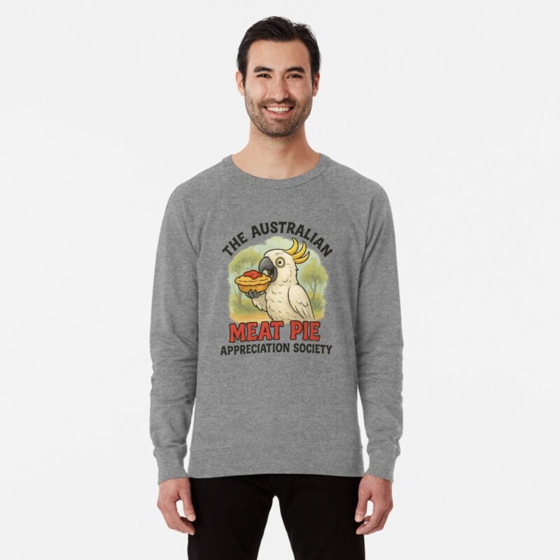 Lightweight sweatshirt with cartoon cockatoo holding meat pie topped with tomato sauce under gum trees