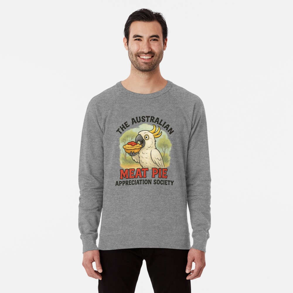 Lightweight sweatshirt with cartoon cockatoo holding meat pie topped with tomato sauce under gum trees