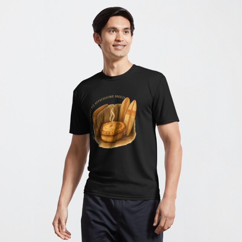Lightweight moisture-wicking active T-shirt printed with golden Aussie meat pie between boomerang and surfboard against ocean beach backdrop