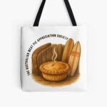 Reusable cotton tote bag printed with golden Aussie meat pie framed by wooden boomerang and surfboard on sandy coastal backdrop