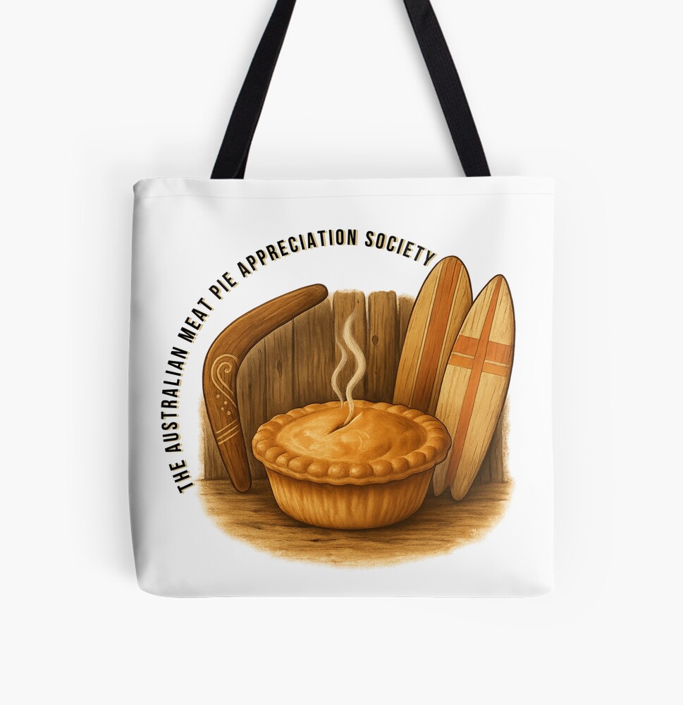 Reusable cotton tote bag printed with golden Aussie meat pie framed by wooden boomerang and surfboard on sandy coastal backdrop