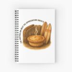 Spiral-bound lined notebook with glossy cover printed with golden Aussie meat pie framed by boomerang and surfboard on beach scene
