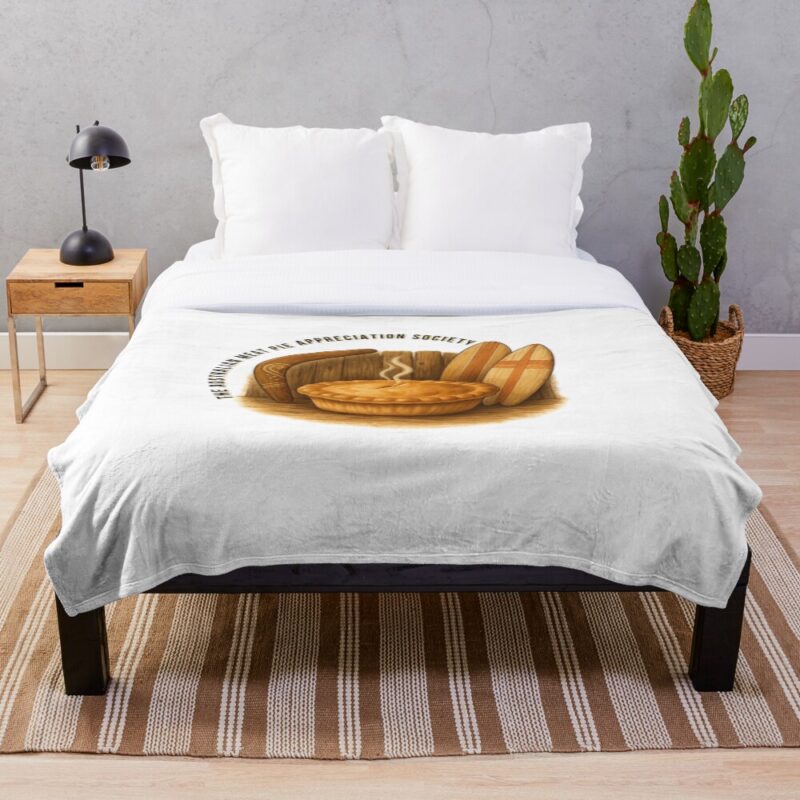 Soft fleece throw blanket printed with golden Aussie meat pie framed by boomerang and surfboard on sandy beach under sunny sky