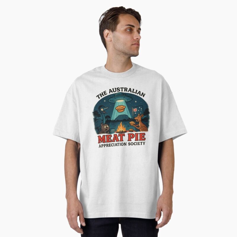 Classic T-shirt featuring cartoon UFO beaming up a golden meat pie over Aussie bush campfire with kangaroo, emu and night sky