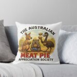 Soft square throw pillow printed with cartoon kangaroo wombat emu enjoying Aussie meat pies under red-earth outback sky